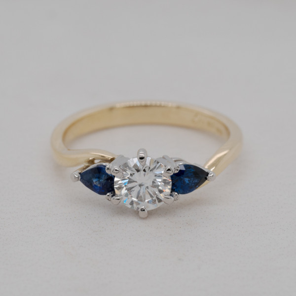 Diamond and Pear Sapphire Three Stone Ring