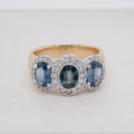 Oval Sapphire Three Stone Halo Ring