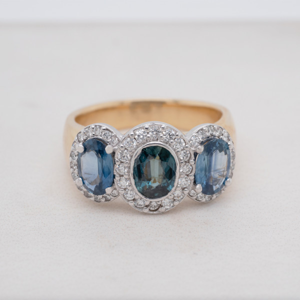 Oval Sapphire Three Stone Halo Ring