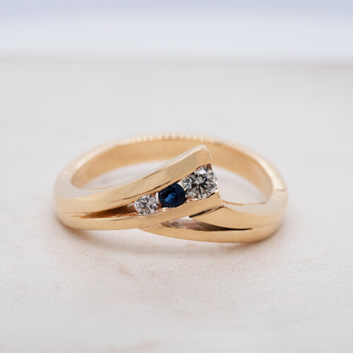 Sapphire and Diamond Channel Set Crossover Ring